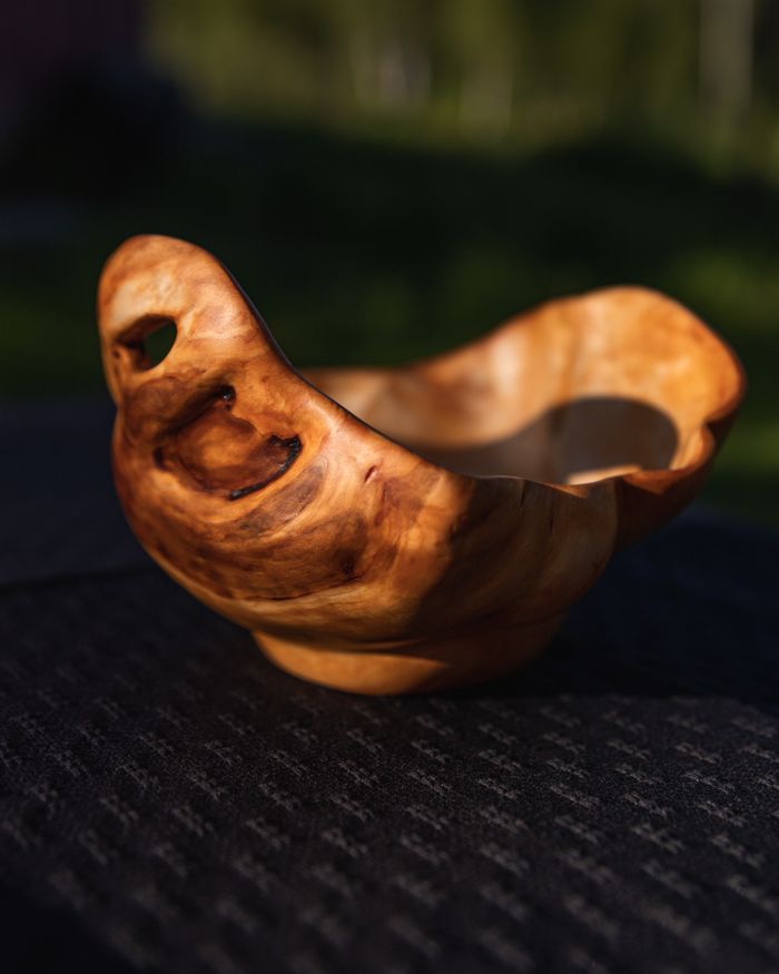 services-03 A handcrafted, artistic wooden bowl with a smooth finish and natural wood grain.